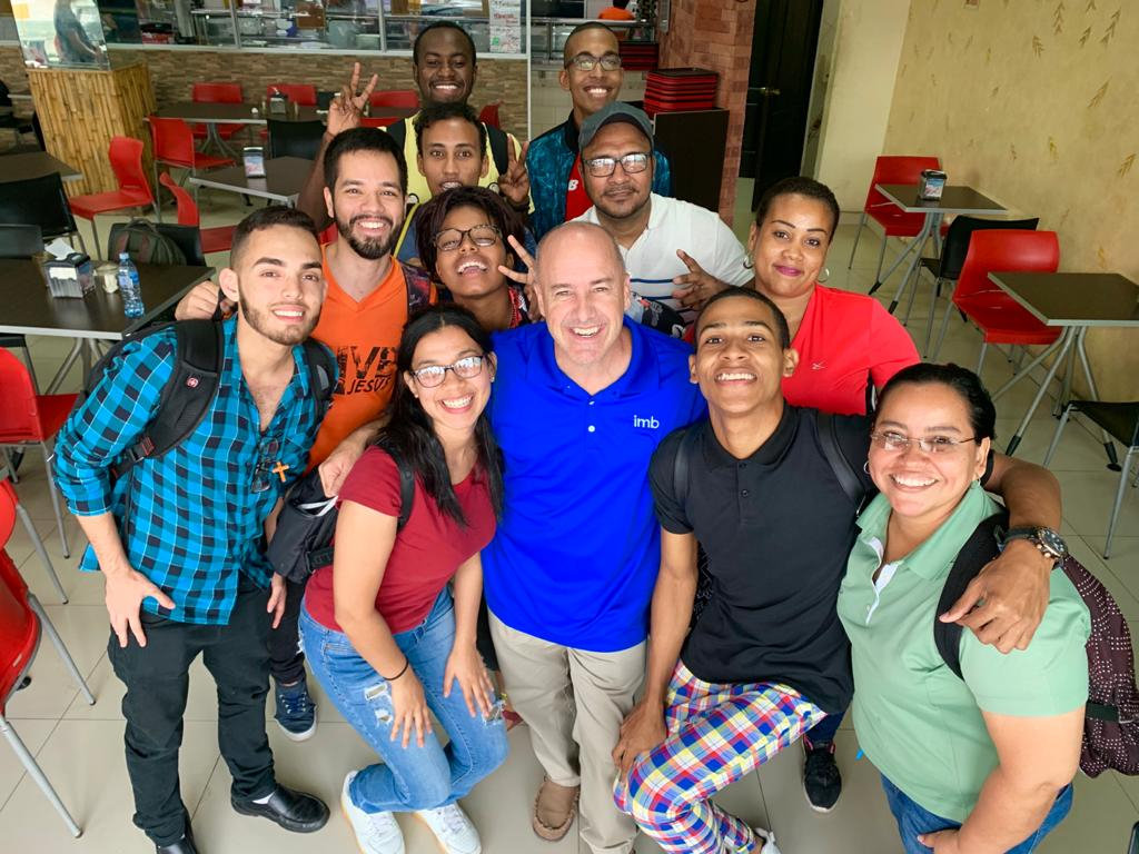 IMB missionary Tim Louderback, (center) and his national partner, Daniel Tejada, (left, orange shirt) stand with students from the University of Panama. Tejada hosts conversational English classes as a means of outreach. He invites the students to join him for weekly Bible studies held in Spanish.  This photo is being used for non-commercial purpose and not in connection with selling a good or service.